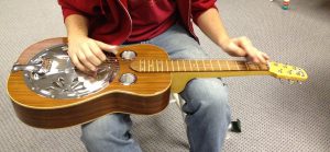 Resonator guitar with flat neck