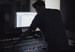 engineer bending over a mix
